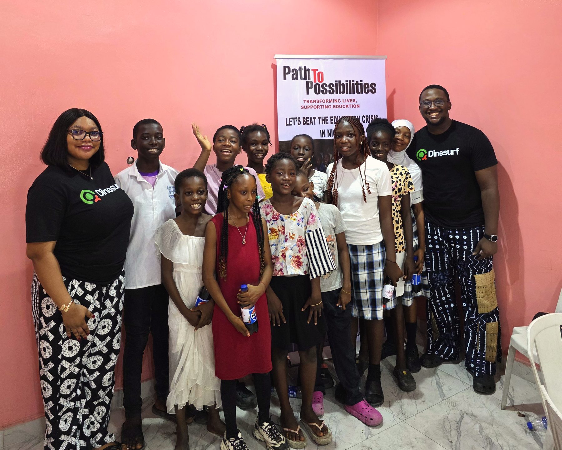 Joshua and a colleague with students at Path to Possibilities